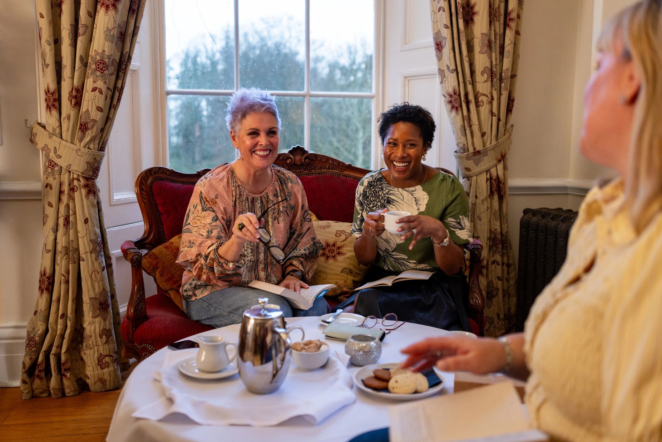 Women gathered for a friendly book club discussion